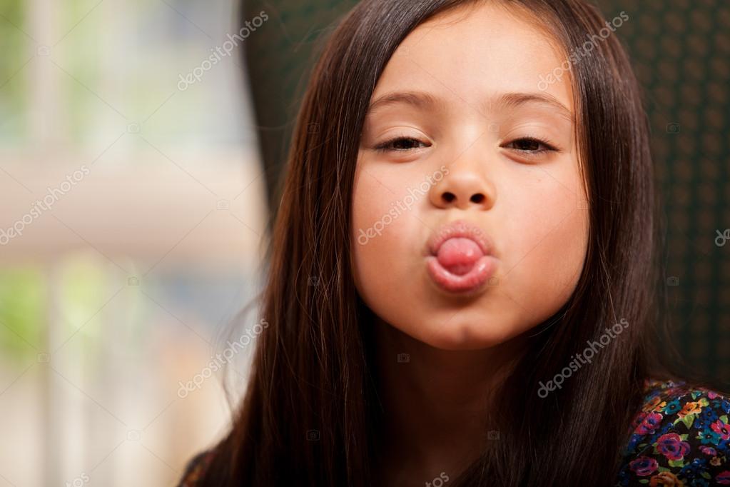 beautiful little girl tongue" Little girl sticking out her tongue — Stock Photo © tonodiaz #32535285