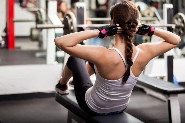 Girl shakes press in the gym — Stock Photo, Image