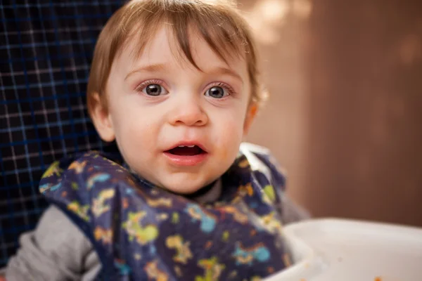 Baby boy sitting in highchair — Stock Photo, Image