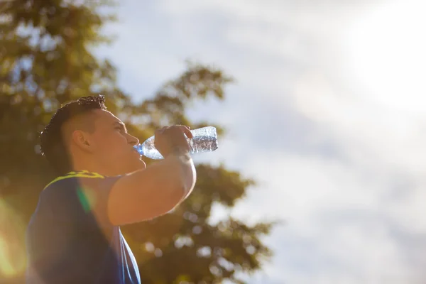Drinking water on a sunny day — Stock Photo, Image