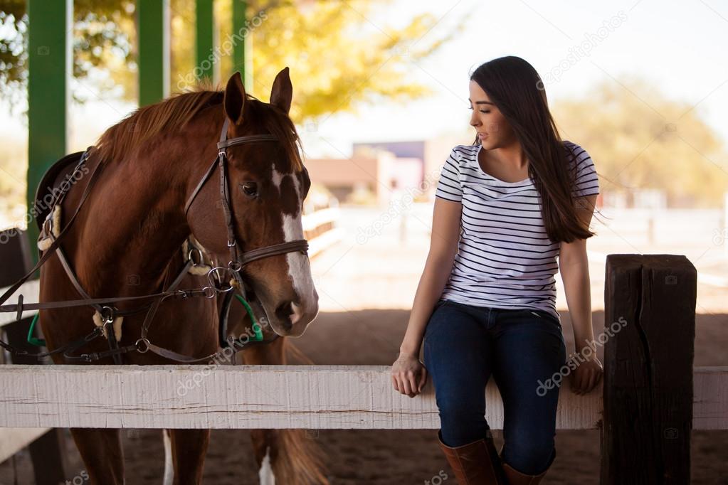 Girl with her horse at a ranch