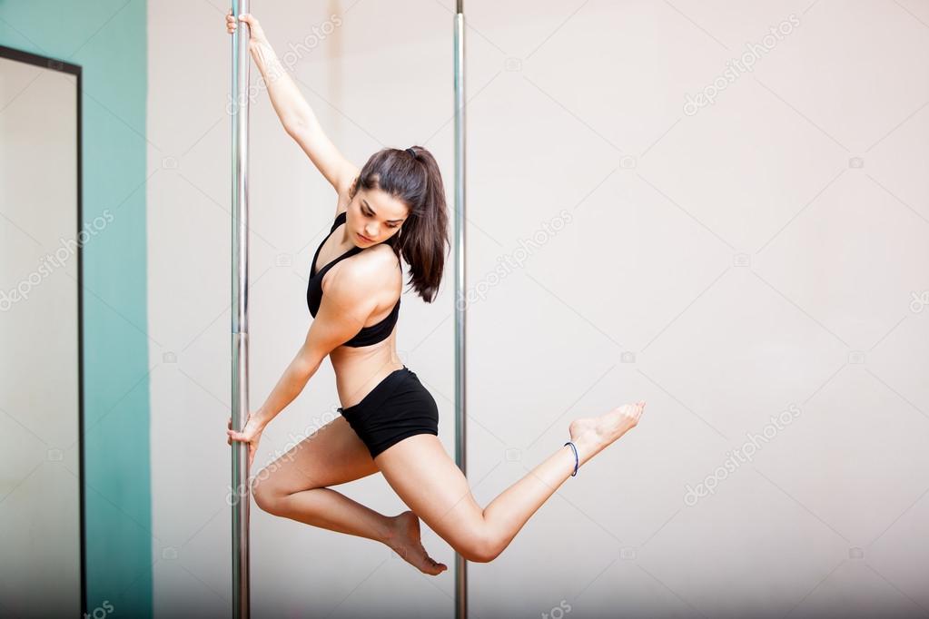 Woman at a pole fitness class