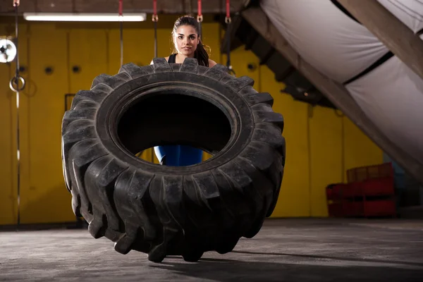 Tire flip in a gym
