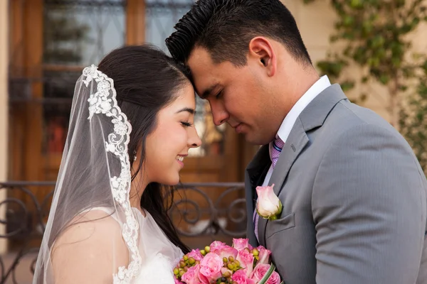 Bride and groom behind her — Stock Photo, Image