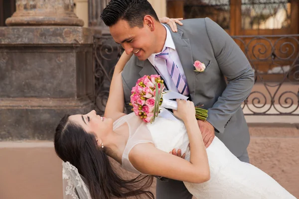 Bride and groom behind her — Stock Photo, Image