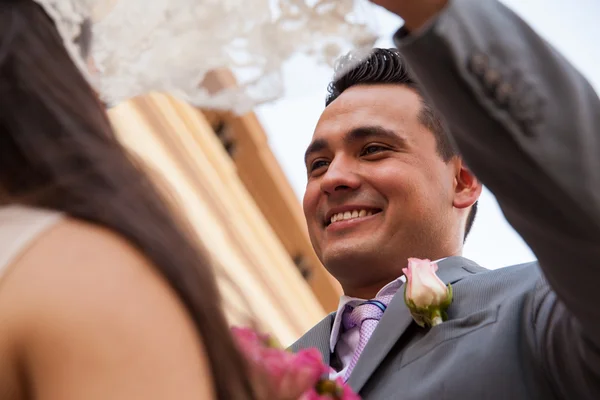 Bride and groom behind her — Stock Photo, Image