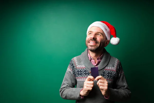 Attractive Young Man Dreaming Wishing Buy Christmas Presents Credit Card — Stock Photo, Image