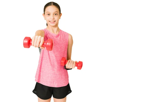 Excited Young Girl Smiling While Lifting Weights Front White Background — Stock Photo, Image