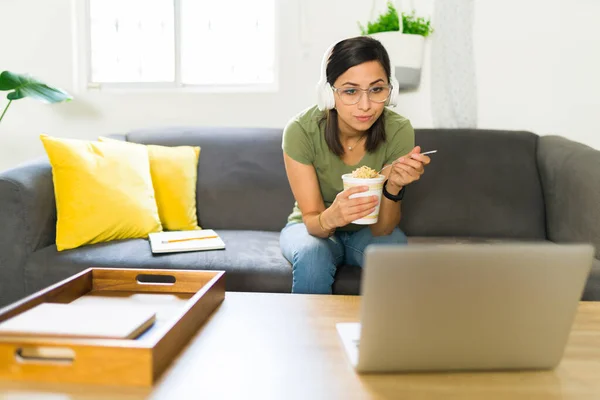 Hungry Mid Adult Woman Headphones Eating Instant Noodle Soup While — Stock Photo, Image