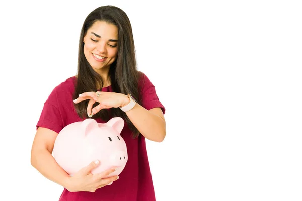 Excited Young Woman Putting Money Her Piggy Bank Smiling Happy — Stock Photo, Image