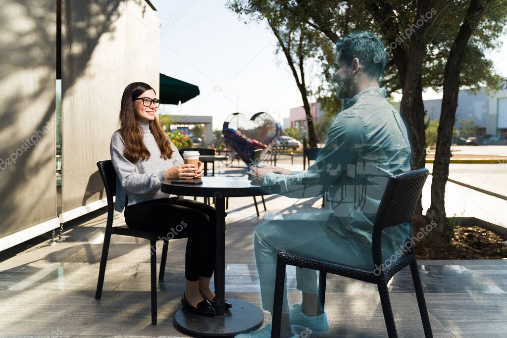 Cyber future. Virtual reality concept of two people talking at a cafe using augmented reality