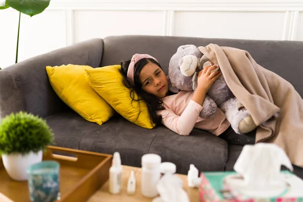 Portrait Sad Little Girl Hugging Teddy Bear Covered Blanket While — Stock Photo, Image