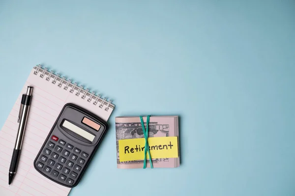 Planning Retirement Notepad Pen Calculator Plan Personal Finances Blue Background — Stock Photo, Image