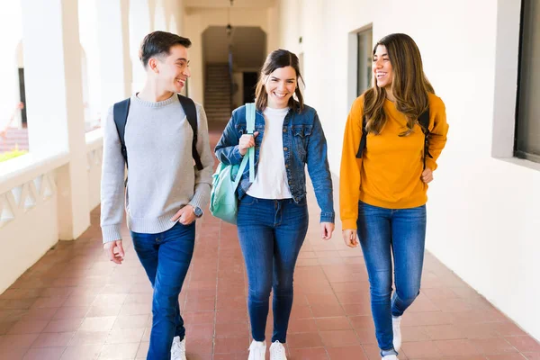 Cheerful College Students Laughing Talking While Walking Together Hallway Way — Foto Stock