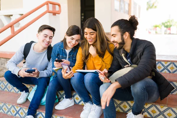 Cheerful Young Woman Showing Her College Friends Online Picture Her — Stok fotoğraf