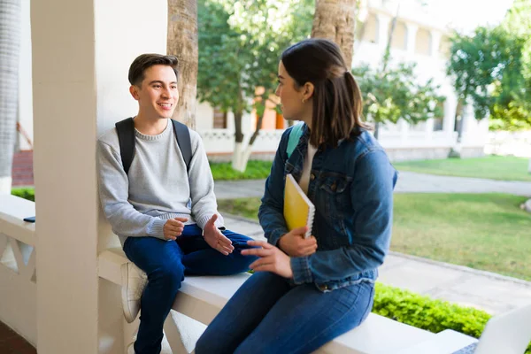 Attractive Young Man Woman Talking While Carrying Backpack Books College — Zdjęcie stockowe