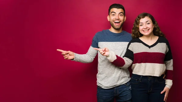 Look Handsome Happy Couple Pointing Next Copy Space While Feeling — Stock Photo, Image