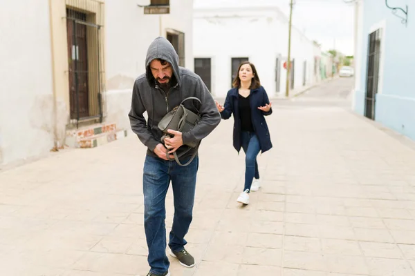 Criminal Thief Walking Away Stealing Handbag Sad Angry Young Woman — Stock Photo, Image