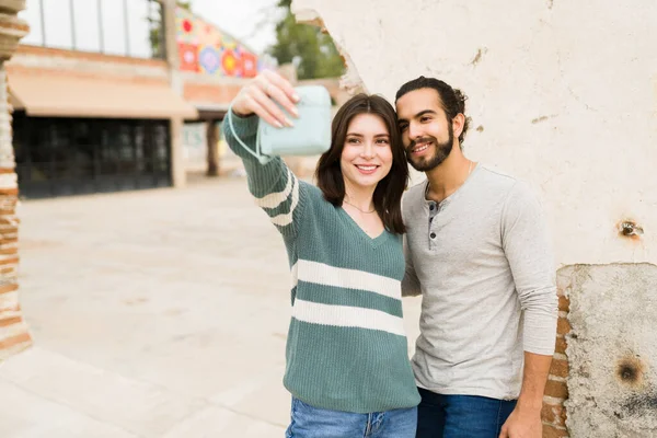 Multiracial Happy Couple Taking Selfie Instant Camera While Enjoying Lovely — Stock Photo, Image