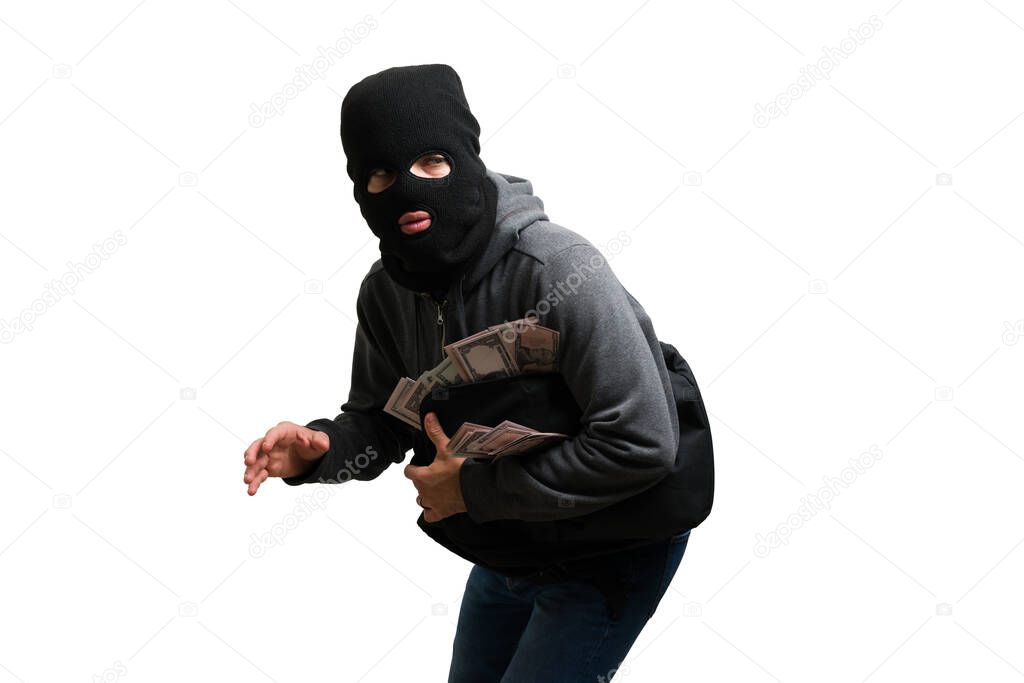 Trying to escape. Suspicious criminal trying to sneak with a backpack full with money after committing a robbery