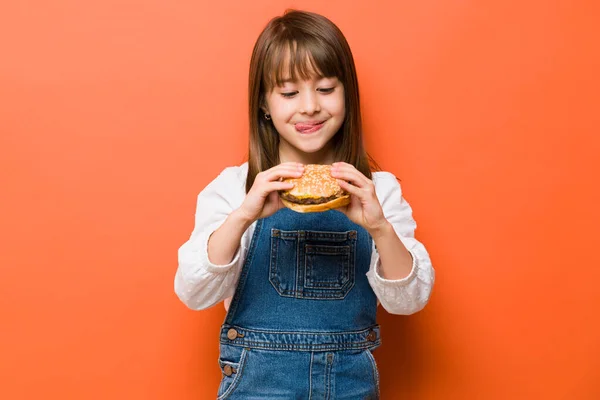 Adorable Little Girl Her Tongue Out Craving Cheeseburger She Eat — Stock Photo, Image