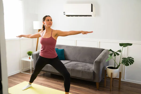 Smiling Young Woman Practicing Yoga Enjoying Cold Air Air Conditioning —  Fotos de Stock