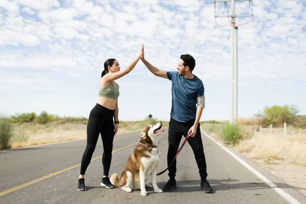 Excited Young Woman Man Making High Five Celebrating Finishing Running — Stockfoto