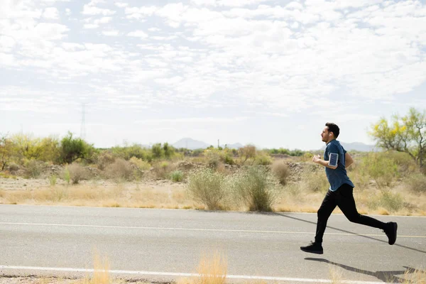 Side View Active Young Man Listening Music While Running Alone — Photo