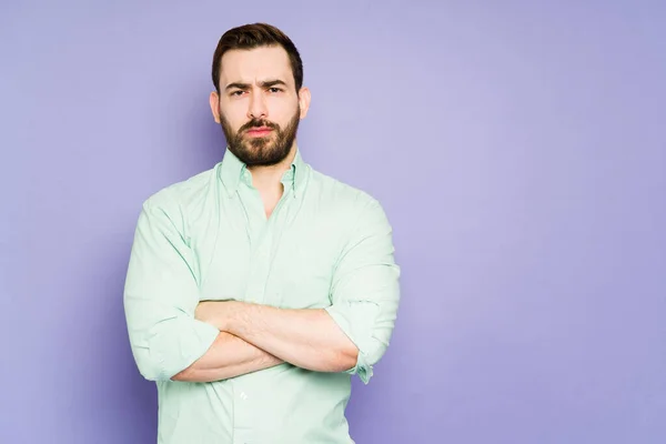 Studio Shot Annoyed Young Man His Arms Crossed Looking Angry — Foto de Stock