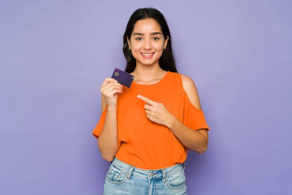 Studio Shot Gorgeous Woman Smiling While Pointing Her New Credit — Stock Fotó