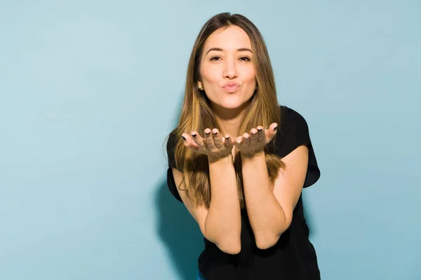 Portrait Beautiful Young Brunette Puckering Her Lips Blowing Kiss Studio — Stock Photo, Image