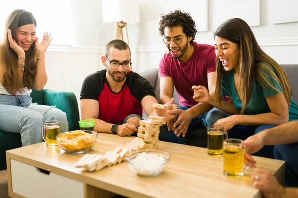 Attractive Diverse Friends Laughing Feeling Happy While Playing Tower Board — Stock Photo, Image