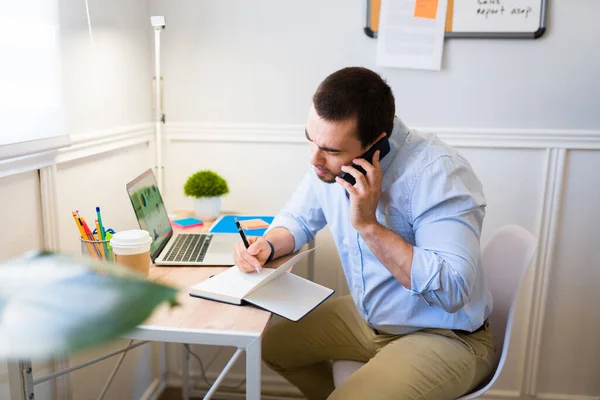 Busy Young Man Talking Client Phone Writing Next Appointment His — Stock Photo, Image