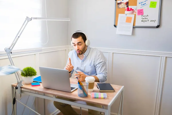 Young Man Wearing Headphones Having Video Call Laptop While Working — Stock Photo, Image