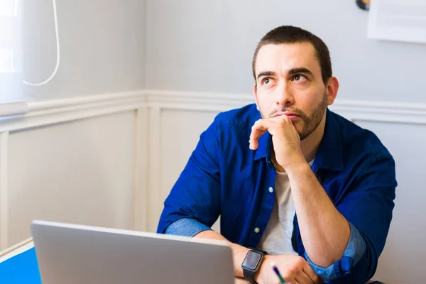 Thoughtful Young Man Looking Thinking New Idea Work While Working — Stock Photo, Image