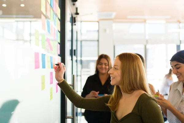 Side View Happy Young Woman Writing Sticky Notes Office Brainstorming — Stockfoto