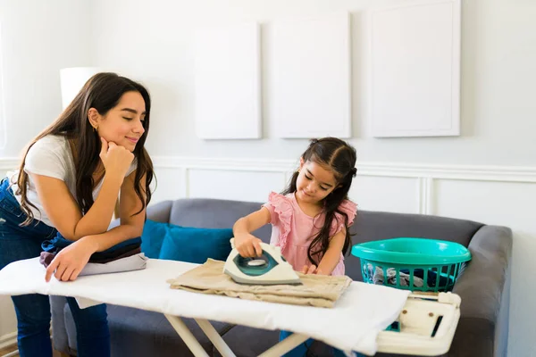 Happy Satisfied Mom Teaching Her Young Child Iron Clothes Laundry — Zdjęcie stockowe