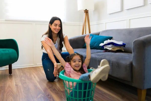 Excited Mom Happy Little Girl Playing Game While Doing Laundry — Foto Stock