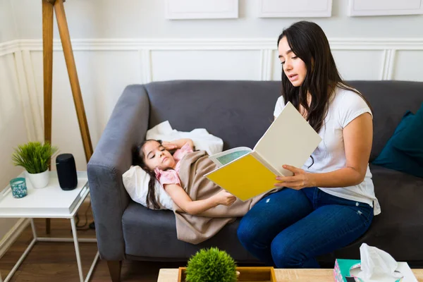 Attractive Mother Reading Story Children Book While Taking Care Her — Foto Stock