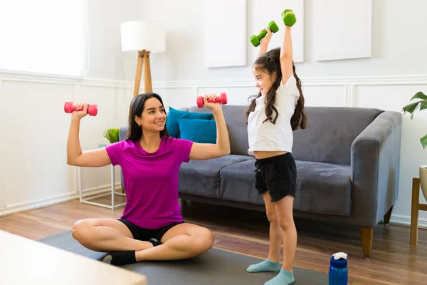 Excited Fit Mother Working Out Home While Lifting Dumbbell Weights — 图库照片