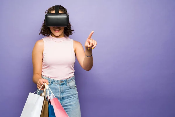 Cheerful Young Woman Carrying Shopping Bags Doing Buying Online Futuristic — Φωτογραφία Αρχείου