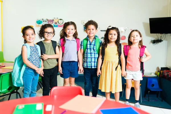 Beautiful Diverse Group Children Backpacks Smiling While Arriving Classroom Preschool — 스톡 사진