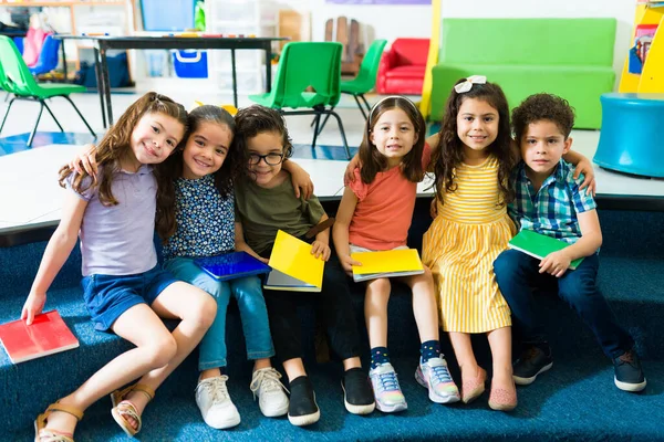 Kindergarten Student Friends Using Notebooks Smiling While Posing Together Preschool — Zdjęcie stockowe