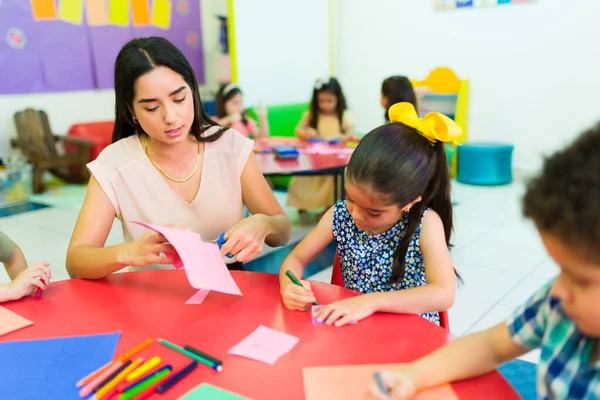 Attractive Teacher Preschool Children Cutting Shapes Scissors Kindergarten Lesson Art — Zdjęcie stockowe