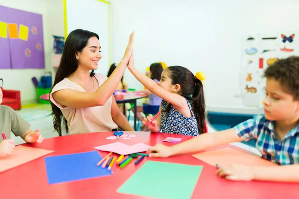 Cheerful Teacher Giving High Five Preschool Student Doing Good Work — Fotografia de Stock