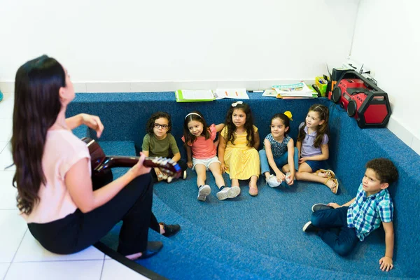 Talented Preschool Teacher Playing Guitar Singing Education Song Her Kindergarten — Fotografia de Stock