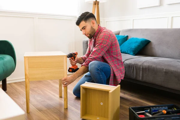 Attractive Handy Man Drilling Using His Tools While Assembling Night — Stockfoto