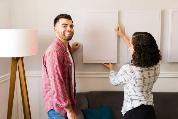 Attractive Young Man Smiling While Making Eye Contact Putting New — Stock Photo, Image