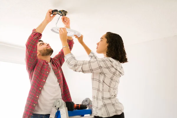 Focused Young Couple Working Together While Doing Home Improvements Repairing — Stok fotoğraf