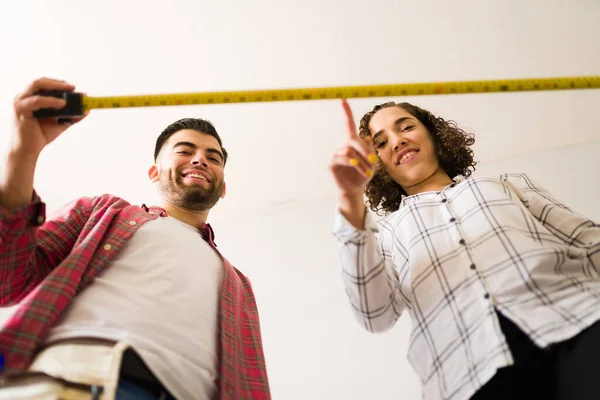 Excited Woman Man Looking While Using Tape Measure Tools While — Stok fotoğraf